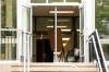 Kelvin High School, with one of the front doors left open in an attempt to combat high temperatures in the building, on Tuesday. (Mikaela MacKenzie / Free Press)