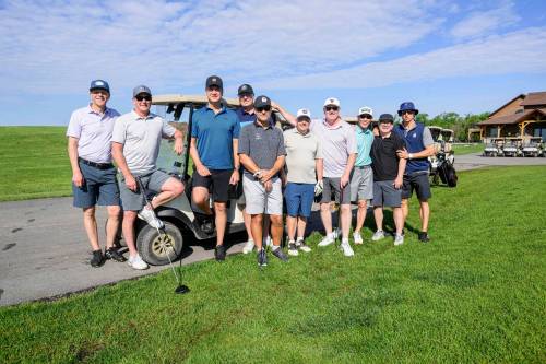 Mike Sudoma/Free Press
                                The group of friends get ready to tee off as Day 2 of the groups 40th annual golf trip commences.