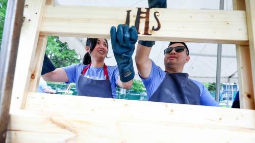 Ruth Bonneville / Free Press
                                Blue Cross employees Karyl Grasparil and her husband Darryl Grasparil work together during a bed-building event to build and assemble 50 twin-sized beds for local children, Friday.