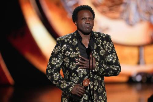 Charles Sykes/Invision
                                Joshua Henry accepts the award for best performance by an actor in a leading role in a musical for Ragtime during the 79th Tony Awards on Sunday.