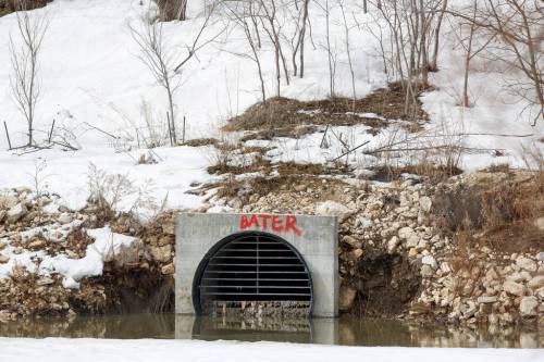 MIKE DEAL / FREE PRESS FILES
                                A combined sewer outlet on the Assiniboine River. The City of Winnipeg counted 1,015 combined sewer overflows last year, when rainy weather caused over 8.8 billion litres of diluted raw sewage to be dumped into Winnipeg rivers.