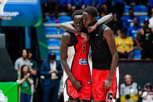 FIBA.BASKETBALL PHOTO

Winnipeg’s Settimo Yugu (right) celebrates with a teammate.