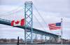 ROB GURDEBEKE / THE CANADIAN PRESS FILES
                                Canadian and American flags fly near the Ambassador Bridge at the Canada/USA border crossing in Windsor, Ont. The bridge has long been a corridor for Canada-U.S. trade.
