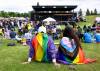 MIKE SUDOMA/FREE PRESS
                                David and Kristen travelled sit on the grass and take in the festivities Saturday at the Triple E main stage in Winkler during Winkler's first Pride celebration Saturday afternoon.
