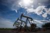 Pumpjacks draw oil out of the ground near Olds, Alta., on July 16, 2020. Alberta&rsquo;s rural towns say unpaid property taxes from the province&rsquo;s struggling oilpatch have tripled in two years. A survey released today by the association of those communities says industry now owes a total of $245 million. Paul Sutherland, president of Rural Municipalities Alberta, says the provincial government should close loopholes that make it tough for communities to collect. (Jeff McIntosh / The Canadian Press files)