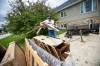 Mikaela MacKenzie / Free Press Files
                                George Bird helps clear out a water-damaged basement in Stonewall after recent rain storms led to a massive number of property and vehicle damage claims across Manitoba.