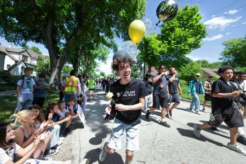 Ruth Bonneville / Free Press
                                St. John&rsquo;s High School graduating student Talon Phrakonekham thanks students for cheering on his class during the grad walk Tuesday.
