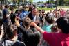 NICOLE BUFFIE / FREE PRESS
                                Premier Wab Kinew greets students outside Lord Selkirk Regional Comprehensive Secondary School, Tuesday.
