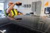 MIKE DEAL / FREE PRESS
                                MPI Estimator, Mike Head, checks out the hail damage to a claimant&rsquo;s car.
