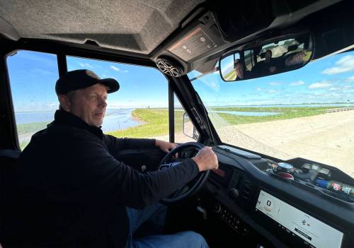 TYLER SEARLE / FREE PRESS 
Brian Boonstra approaching the Sturgeon Creek bridge near his property
