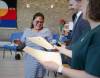 RUTH BONNEVILLE / FREE PRESS
                                Princess Nakpil receives her graduation certificate from Seyward Goodhand, the creative writing instructor and Aaron Klassen, Shelter U program director, in the chapel at the Salvation Army Thursday.