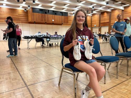 NICOLE BUFFIE / FREE PRESS
                                Zoe Yanke, 16, bused from her home community of Gillam to run in the Manitoba Marathon 10-kilometre race Sunday morning. She and about a dozen of her peers are participating in several of the events and were gifted a new pair of shoes ahead of race day through the Soles4Souls program.