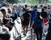 JOHN WOODS / FREE PRESS Tammy Gibson reaches out to her husband Barry as he and other runners start their 10K runs in the Manitoba Marathon at the University of Manitoba Sunday, June 21, 2026. reporter: ?