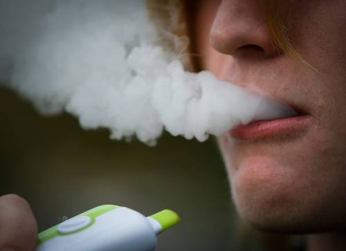 JOHN WOODS / WINNIPEG FREE PRESS West Kildonan Collegiate student vapes in Winnipeg, Monday, September 26, 2022. The school has sent out letters to students saying they will be disciplined if found vaping. Re: macintosh