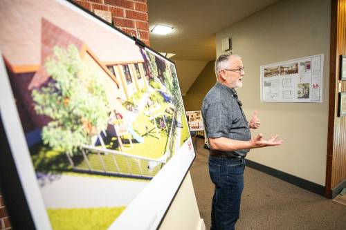 MIKAELA MACKENZIE / FREE PRESS
                                John McNairnay, congregation member and vice-chair of the South Osborne Commons, guides media through the space at the announcement for plans to turn Churchill Park United Church into South Osborne Commons.