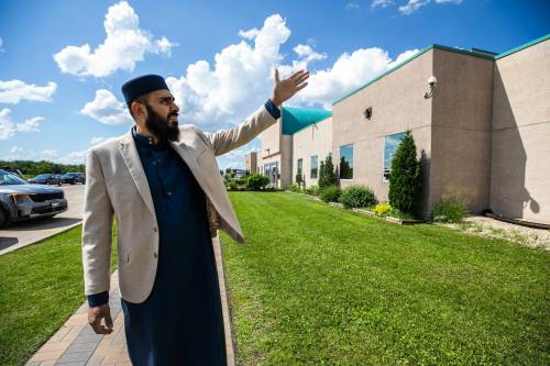 MIKAELA MACKENZIE / FREE PRESS
                                Hakim Ghulam shows security measures in place at the Grand Mosque in Winnipeg on Thursday.