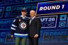 Adrian Kraus / The Associated Press
                                Viggo Björck sports a Winnipeg Jets jersey as he stands next to NHL Commissioner Gary Bettman after being drafted by the Jets in the first round of the 2026 NHL Draft Friday, in Buffalo, N.Y.