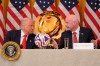 FILE - President Donald Trump and FIFA President Gianni Infantino talk during a FIFA task force meeting in the East Room of the White House, May 6, 2025, in Washington. (AP Photo/Mark Schiefelbein, File)