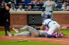 Detroit Tigers designated hitter Colt Keith (33) is tagged out by New York Mets catcher Francisco Alvarez (4) at home base during the fifth inning of a baseball game, Tuesday, May 12, 2026, in New York. (AP Photo/Yuki Iwamura)