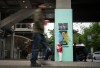 A person waits on their phone on a pillar decorated with FIFA World Cup 2026 branding in Vancouver, on Monday, May 25, 2026. THE CANADIAN PRESS/Ethan Cairns