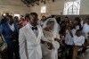 A newly married couple walks down the aisle at their wedding amid an Ebola outbreak in Ituri Province in Bunia, Congo, Saturday, June 6, 2026. (AP Photo/Moses Sawasawa)