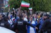 Fans for team Iran wave as players arrive for the World Cup soccer tournament in Tijuana, Mexico, Sunday, June 7, 2026. (AP Photo/Gregory Bull)