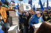 Supporters carry boxes of signatures to submit for a separation referendum to Elections Alberta in Edmonton, on Monday, May 4, 2026. THE CANADIAN PRESS/Jason Franson