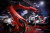 Delegates look on as a robot welds pipe during a demonstration at the Global Energy Show in Calgary on Tuesday, June 10, 2025. THE CANADIAN PRESS/Jeff McIntosh