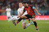 Canada's Alistair Johnston, left, challenges for the ball with Belgium's Eden Hazard during the World Cup group F soccer match between Belgium and Canada, at the Ahmad Bin Ali Stadium in Doha, Qatar, Wednesday, Nov. 23, 2022. (AP Photo/Hassan Ammar)