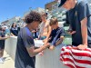 United States defender Chris Richards, front left, gives autographs to fans after the nationall team's first practice at its World Cup soccer tournament training base in Irvine, Calif., Monday, June 8, 2026. (AP Photo/Greg Beacham)