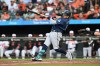 Seattle Mariners' Josh Naylor follows through on a grand slam against the Baltimore Orioles in the fifth inning of a baseball game, Monday, June 8, 2026, in Baltimore. (AP Photo/Gail Burton)