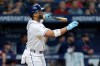 Tampa Bay Rays' Yandy Díaz watches his run scoring sacrifice fly off Boston Red Sox's Alec Gamboa during the eighth inning of a baseball game Monday, June 8, 2026, in St. Petersburg, Fla. (AP Photo/Chris O'Meara)