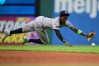 New York Yankees second baseman Jazz Chisholm Jr. dives in an attempt to field a ball hit by Cleveland Guardians' Jose Ramirez during the third inning of a baseball game Monday, June 8, 2026, in Cleveland. (AP Photo/David Dermer)