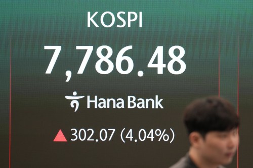 A dealer stands near the screen showing the Korea Composite Stock Price Index (KOSPI) at a dealing room of Hana Bank in Seoul, South Korea, Tuesday, June 9, 2026. (AP Photo/Lee Jin-man)