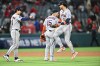Houston Astros right fielder Cam Smith, right, is greeted by third baseman Isaac Paredes (15) after defeating the Los Angeles Angels in a baseball game Monday, June 8, 2026, in Anaheim, Calif. (AP Photo/William Liang)