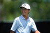 FILE - Miles Russell smiles after his tee shot on the 10th hole during the first round of the Rocket Mortgage Classic golf tournament at Detroit Country Club, June 27, 2024, in Detroit. (AP Photo/Paul Sancya, File)