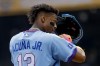 Atlanta Braves' Ronald Acuna Jr. adjusts his helmet while standing on third base against the Pittsburgh Pirates during the first inning of a baseball game, Saturday, June 6, 2026, in Atlanta. (AP Photo/Erik S. Lesser)