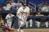 Miami Marlins' Kyle Stowers watches his hit to center field during the sixth inning of a baseball game against the Arizona Diamondbacks Tuesday, June 9, 2026, in Miami. (AP Photo/Marta Lavandier)