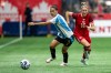 Argentina's Eliana Stabile (3) and Canada's Janine Sonis (16) vie for the ball during the first half of an international friendly soccer match in Vancouver, on Friday, April 4, 2025. THE CANADIAN PRESS/Ethan Cairns