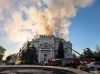In this photo provided by Sevastopol mayor Mikhail Razvozhaev telegram channel on Wednesday, June 10, 2026, Firefighters put out a fire after a Ukrainian drone attack hit the building of 