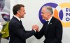 Prime Minister Mark Carney, right, shakes hands with French President Emmanuel Macron as they arrive to take part in a meeting on the situation in Ukraine during the 8th European Political Community Summit in Yerevan, Armenia, on Monday, May 4, 2026. THE CANADIAN PRESS/Sean Kilpatrick