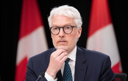 Privacy Commissioner Philippe Dufresne listens to a question during a news conference in Ottawa, Wednesday, May 6, 2026. THE CANADIAN PRESS/Adrian Wyld
