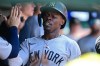 New York Yankees' Jazz Chisholm Jr. is congratulated in the dugout after scoring a run on an error by Cleveland Guardians second basemen Travis Bazzana during the second inning of a baseball game, Wednesday June 10, 2026, in Cleveland. (AP Photo/David Dermer)