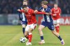 FILE - Kaiserslautern's Ivan Prtajin, left, and Berlin's Kennet Eichhorn, right, challenge for the ball during the German soccer cup round of sixteen match between Hertha BSC Berlin and 1. FC Kaiserslautern in Berlin, Germany, Dec. 2, 2025. (Andreas Gora/dpa via AP, File)