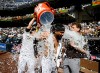 San Diego Padres' Fernando Tatis Jr. has a cooler dumped over him by Ty France after he hit a walk-off home run during a baseball game against the Cincinnati Reds, Wednesday, June 10, 2026, in San Diego. (AP Photo/Denis Poroy)