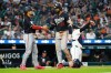 Minnesota Twins' Byron Buxton, right, celebrates his three-run home run with Austin Martin, left, during the fifth inning of a baseball game Wednesday, June 10, 2026, in Detroit. (AP Photo/Paul Sancya)