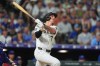 Colorado Rockies' TJ Rumfield follows the flight of his two-run home run off Chicago Cubs relief pitcher Jacob Webb in the eighth inning of a baseball game Wednesday, June 10, 2026, in Denver. (AP Photo/David Zalubowski)