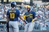 Milwaukee Brewers' Gary Sanchez (99) is greeted by Milwaukee Brewers' Sal Frelick (10) after hitting a solo home run during the second inning of a baseball game against the Athletics, Wednesday, June 10, 2026, in Las Vegas. (AP Photo/Caroline Brehman)