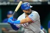 Texas Rangers' Elias Diaz waits to hit an RBI double during the 10th inning of a baseball game against the Kansas City Royals, Wednesday, June 10, 2026, in Kansas City, Mo. (AP Photo/Charlie Riedel)
