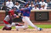 St. Louis Cardinals catcher Jimmy Crooks watches as New York Mets' Juan Soto follows through on a home run during the seventh inning of a baseball game Thursday, June 11, 2026, in New York. (AP Photo/Frank Franklin II)